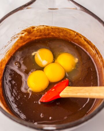 A bowl with chocolate and eggs to make brownies.
