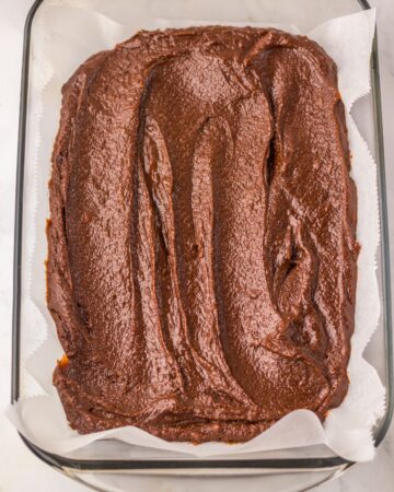 Batter for brownies in a baking pan.