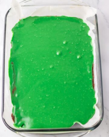 A rectangle baking dish with the ingredients for cosmic Christmas tree brownies.