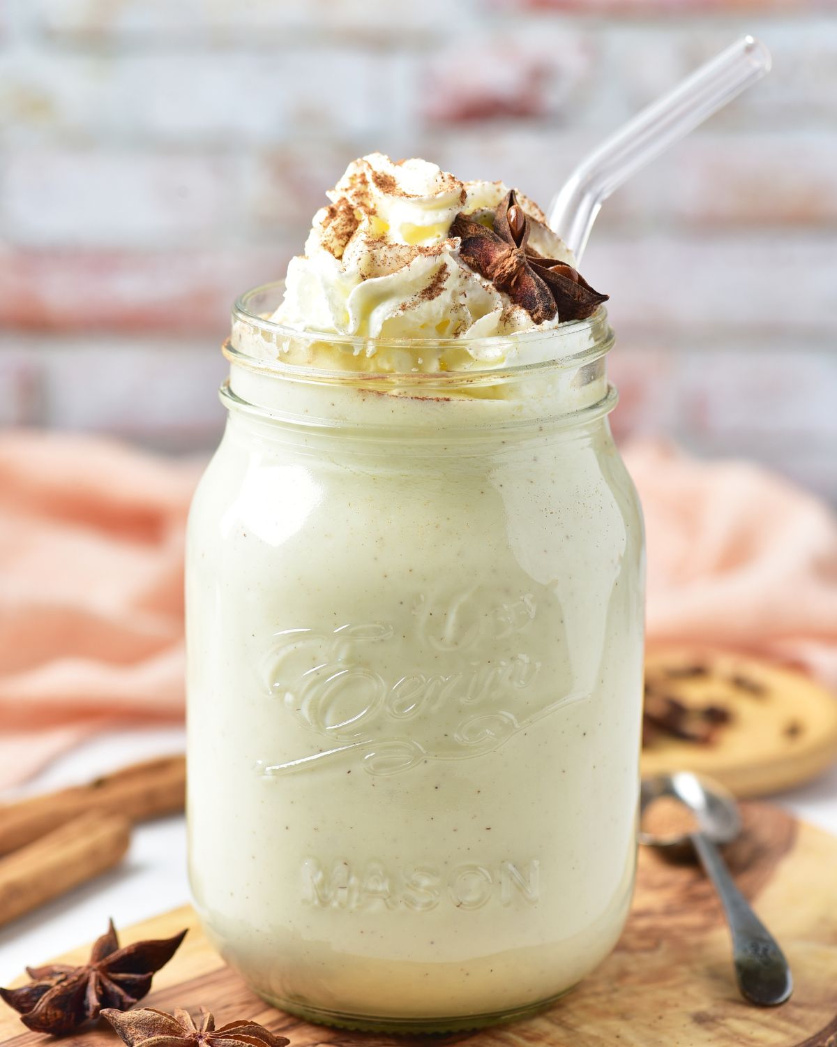 Homemade eggnog topped with whipped cream.