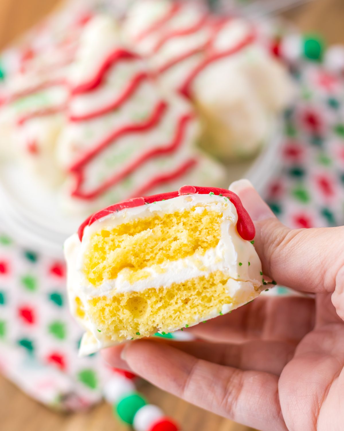A bite out of a little debbie christmas tree homemade cake.