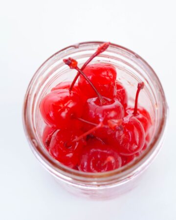 Boozy cherries in a mason jar.