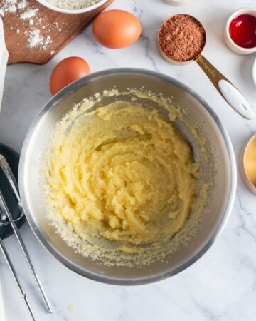 A mixing bowl with butter and sugar creamed together to make a brownie batter. 
