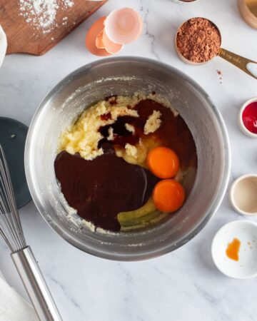 Ingredients in a mixing bowl to make red velvet brownies.