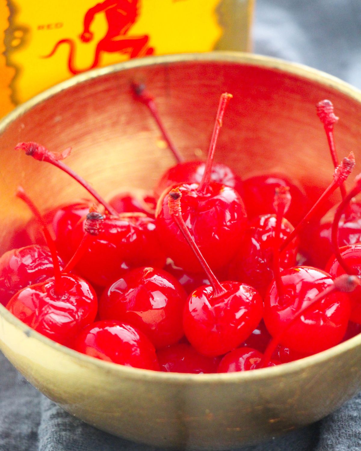 Marinated cherries in fireball in a bowl.