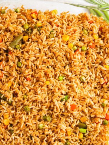 Baked fried rice in a pan with vegetables.