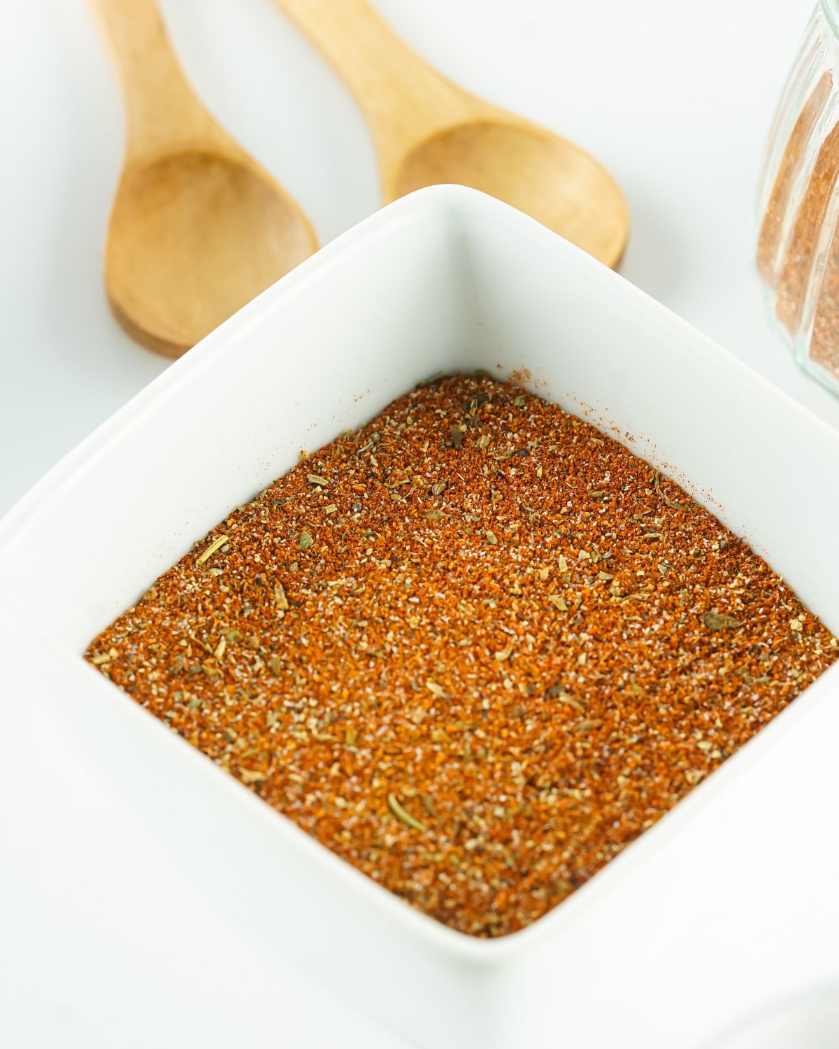 Blackening seasoning mix in a white square bowl.