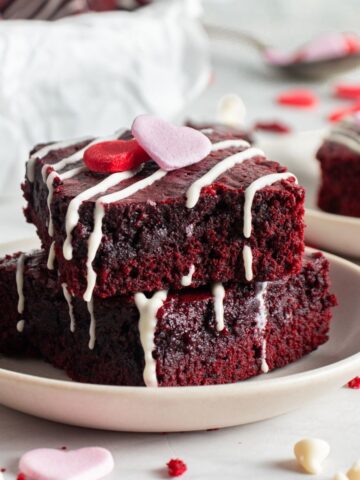 Red velvet brownies sliced on a plate.