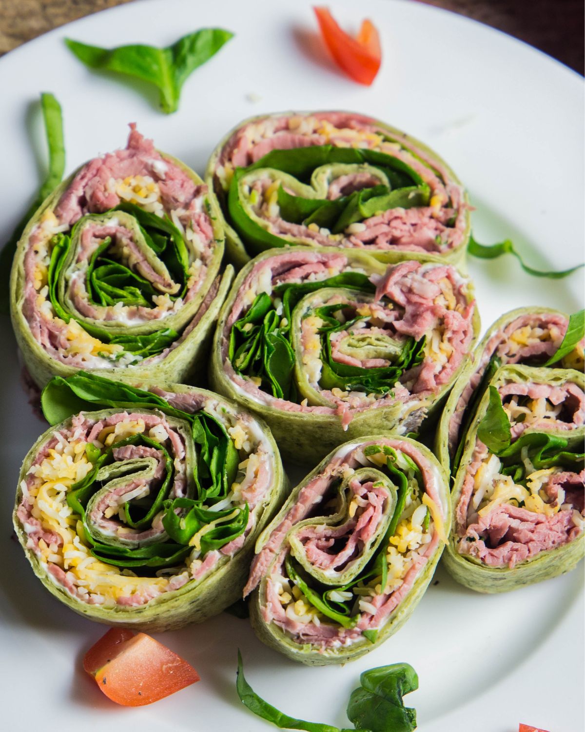 Roast beef rollups on a plate.