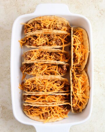 Easy baked tacos made with ground beef in hard taco shells in a casserole.