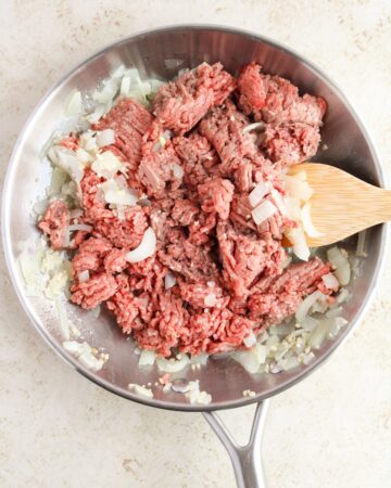 Ground beef and onions sauteed to make baked beef tacos.
