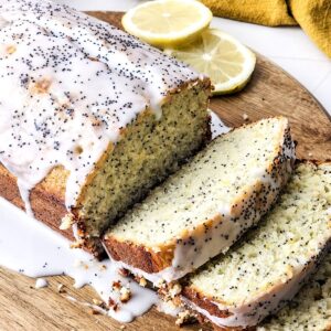 Lemon poppy seed loaf on a wooden platter.