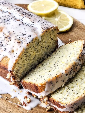 Lemon poppy seed loaf on a wooden platter.