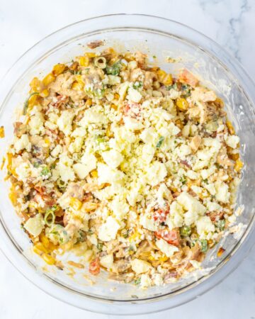 A Mexican street corn chicken salad in a bowl.