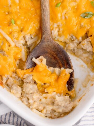 Hamburger hash brown casserole with cheesy topping.
