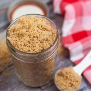 Brown sugar made with molasses in a mason jar.