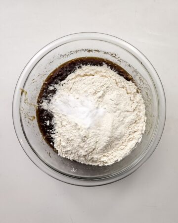 A bowl with wet and dry ingredients to make Oreo smores cookies.