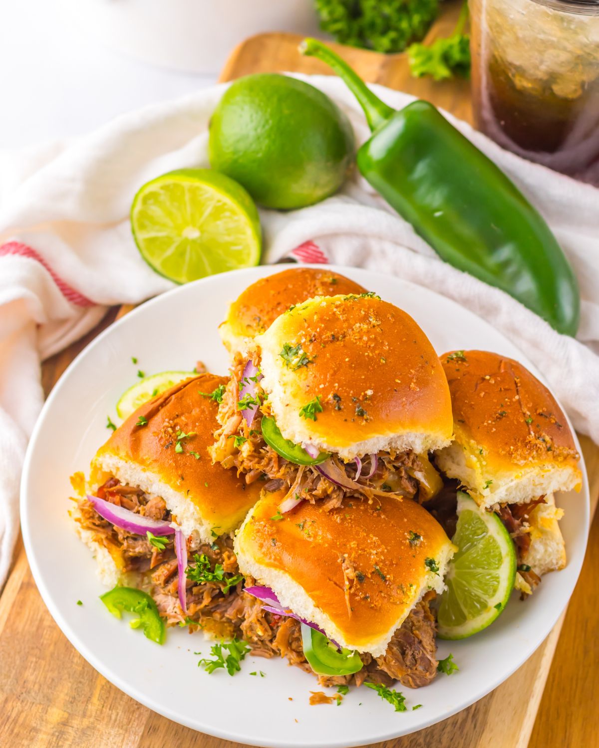 Beef Birria Sliders made in the slow cooker in Hawaiian slider rolls. 
