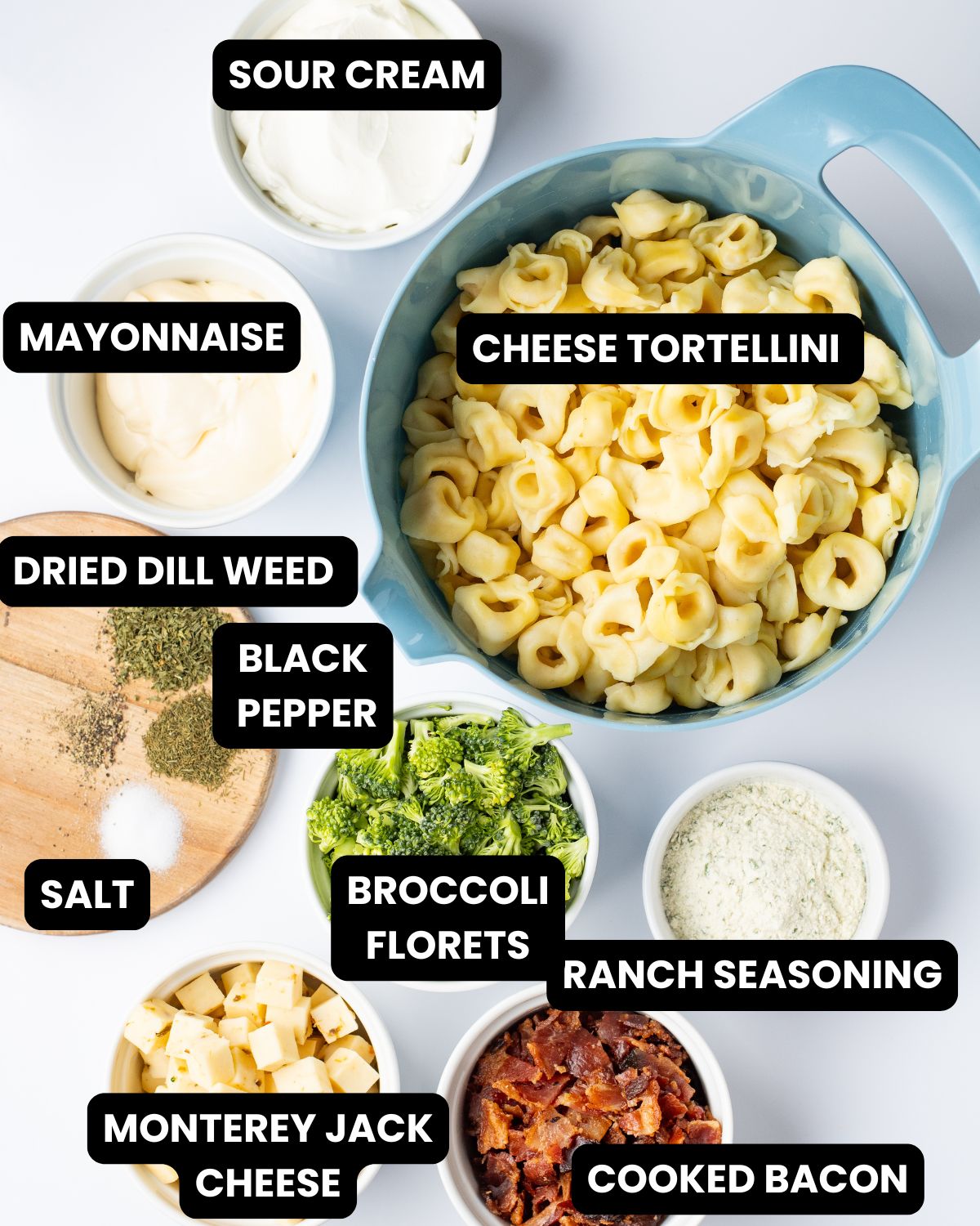 Ingredients with text overlay to make tortellini salad with broccoli and bacon in a ranch dressing.