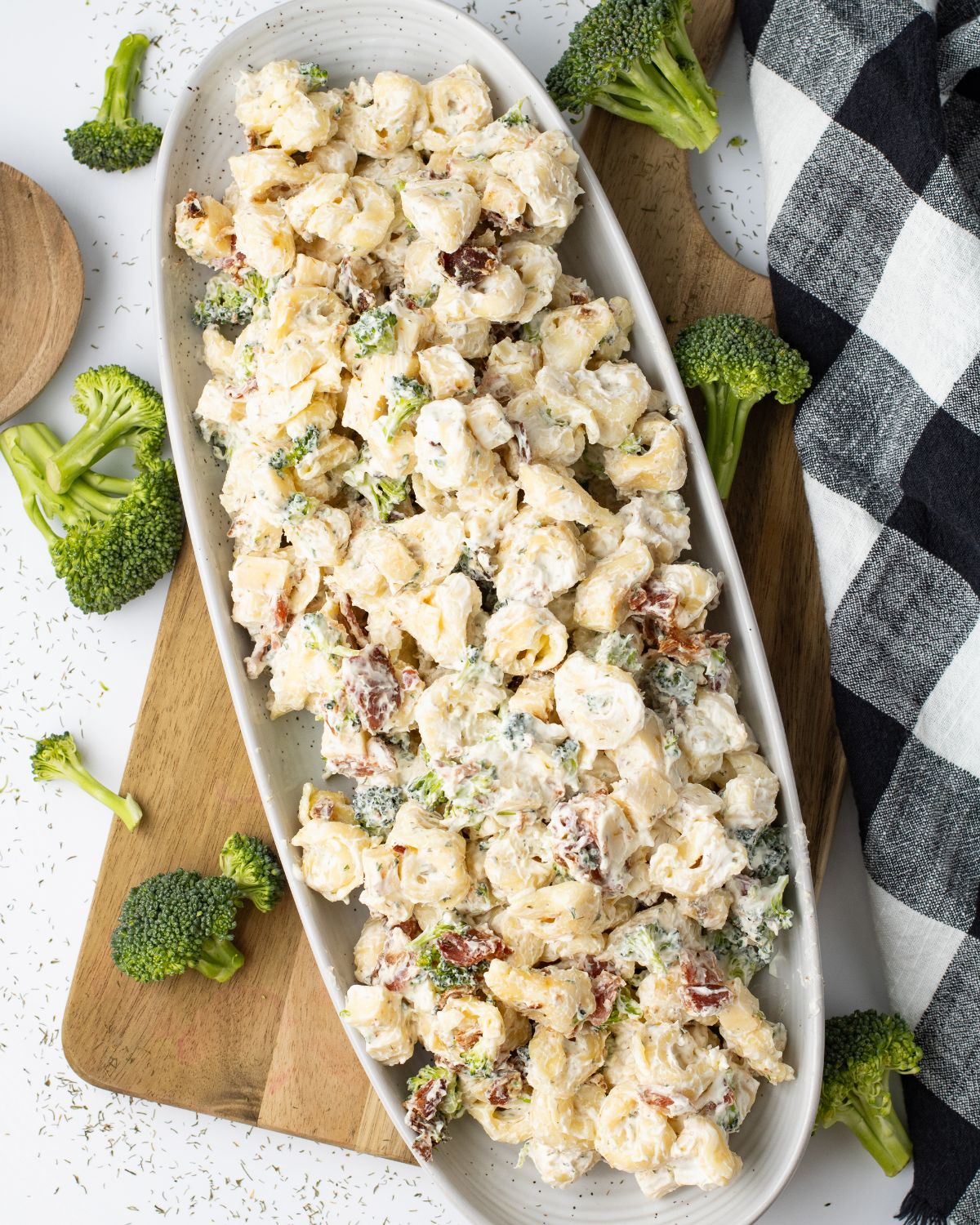 An oval platter with ranch tortellini salad in the bowl.