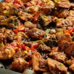 Asian Chicken and Vegetables in a soy and ginger glaze on a sheet pan.