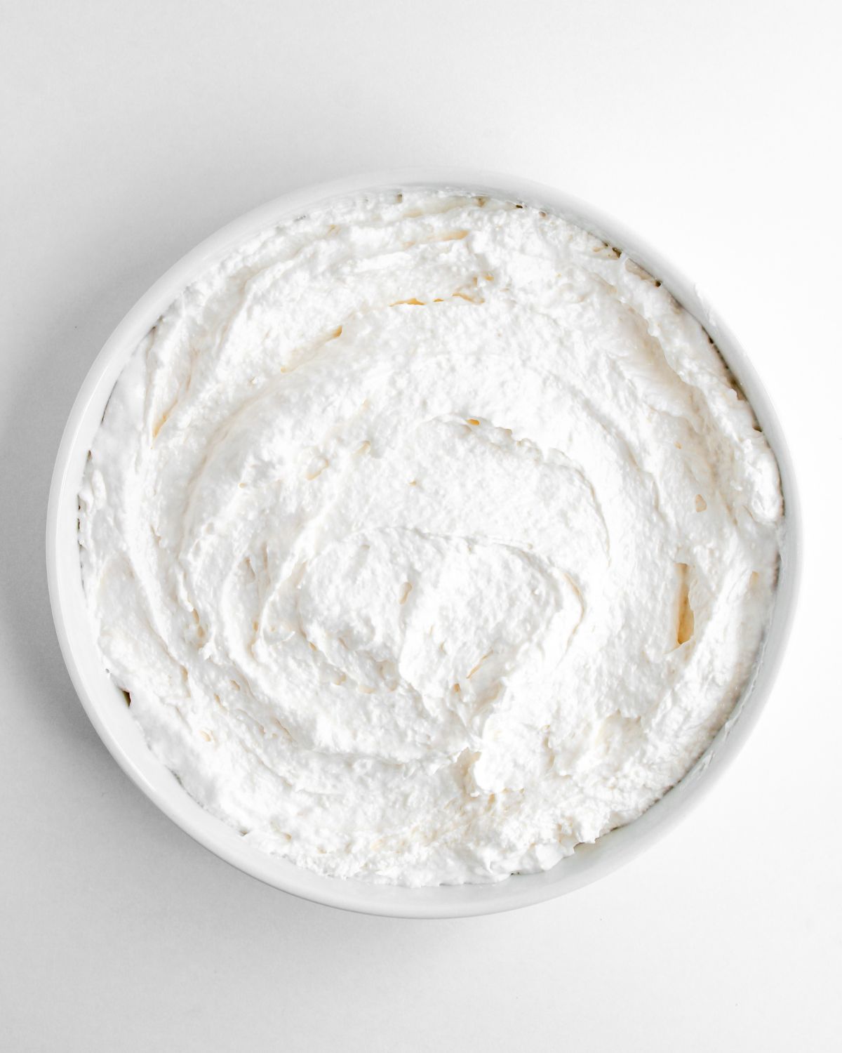 The base of a pecan pie dip with cream cheese and confectioners sugar to make the base of a pecan pie dip.