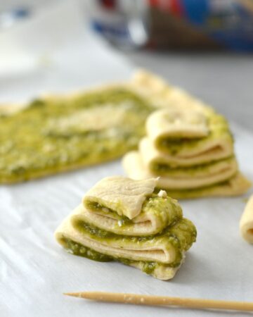Crescent dough cut into strips and folded into a Christmas tree with basil pesto as the filling.