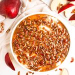 No Bake Pecan Pie dip in a whote bowl with apples on the side.