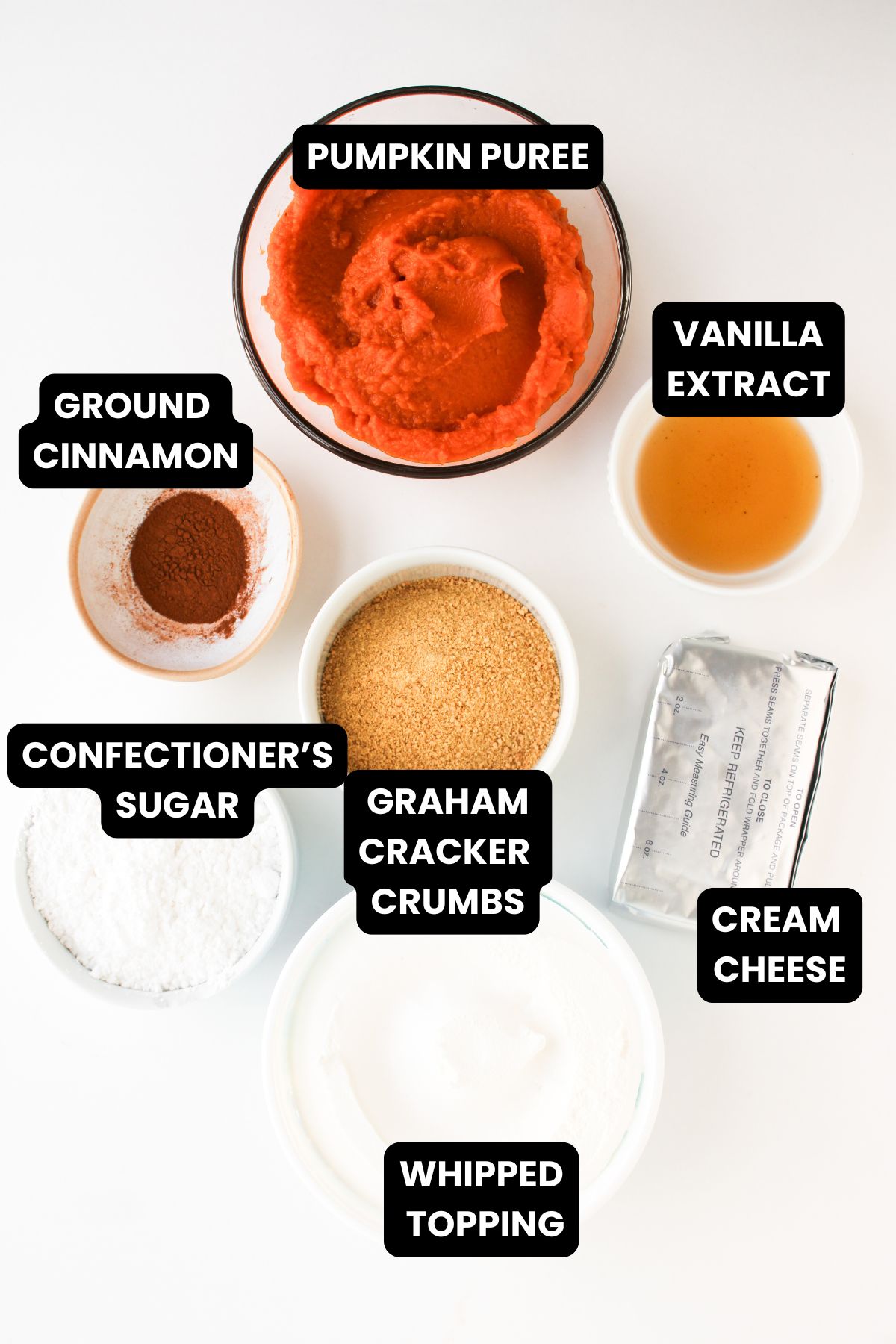 Ingredients to make pumpkin pie dip with cool whip with text overlay.