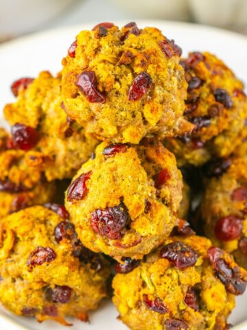 A stack of cranberry turkey stuffing balls on a plate.