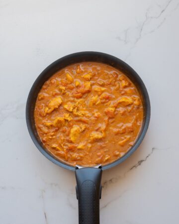 Chicken thighs in a cream butter sauce for the Indian dish butter chicken.