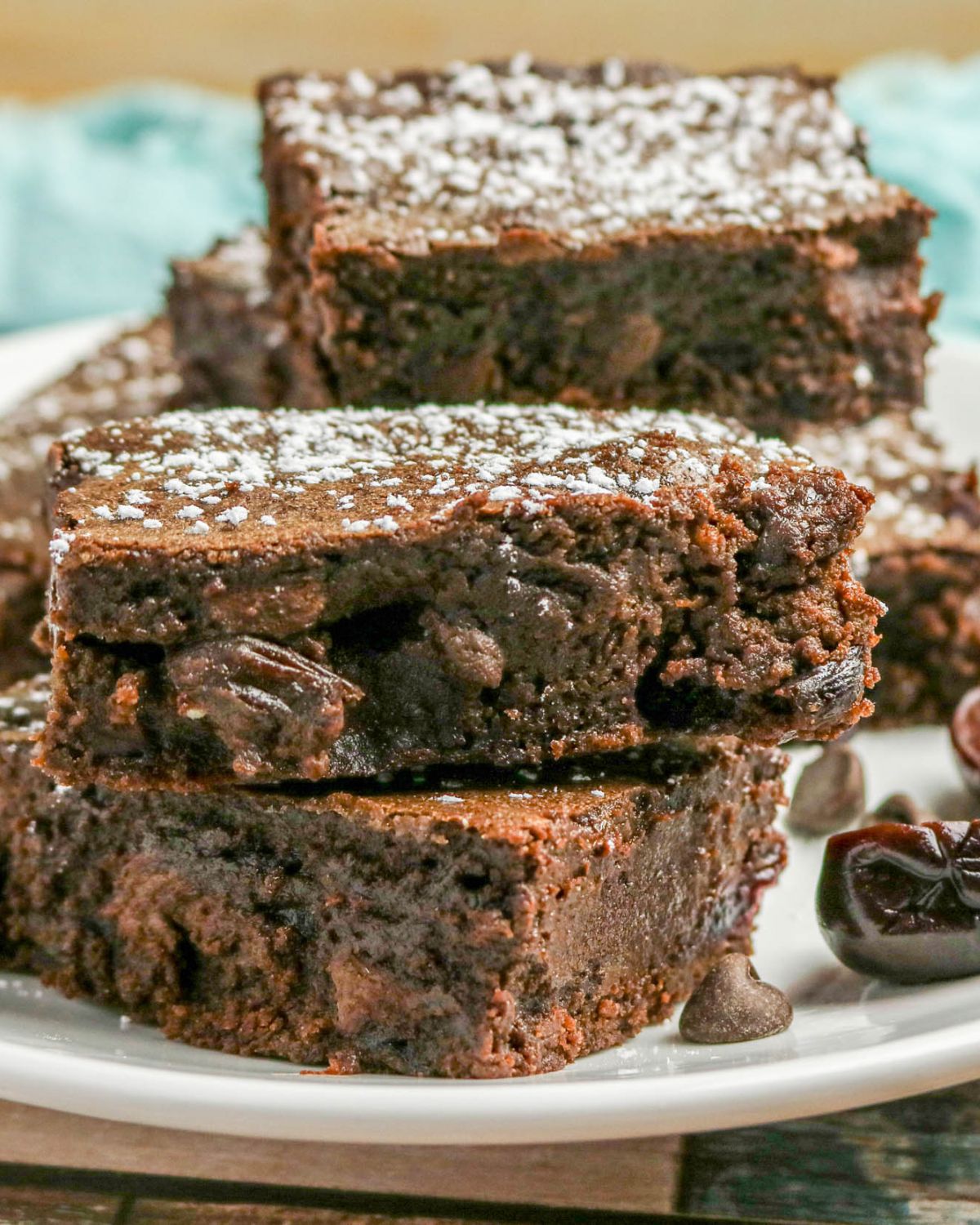 A stack of sliced brownies made with fresh cherries.