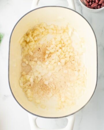 Onions diced in a dutch oven to make pasta fagiole soup.