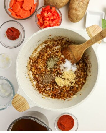 A Dutch oven with onions and spices to make Hungarian Goulash Stew.