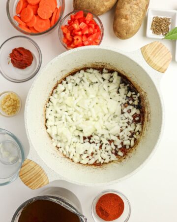 Diced onions in a Dutch Oven to make Authentic Hungarian Goulash.