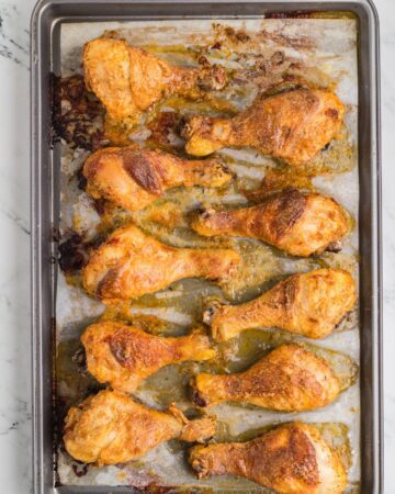 Oven baked crispy baked chicken on a baking sheet.
