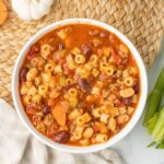 A bowl of pasta e fagiole recipe with ditalini, beans, and ground beef.