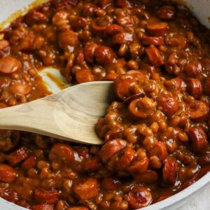 Easy beanie weenies made with hot dogs and baked beans.