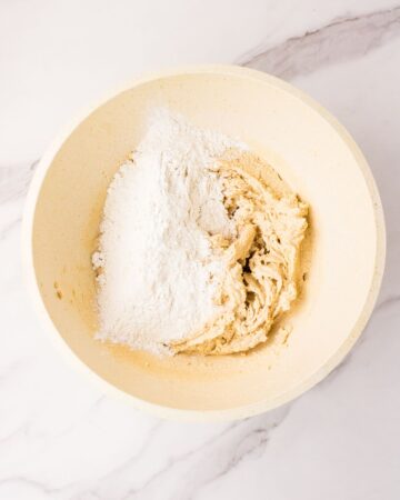 Adding dry ingredients to wet ingredients make eggless chocolate chip cookies.