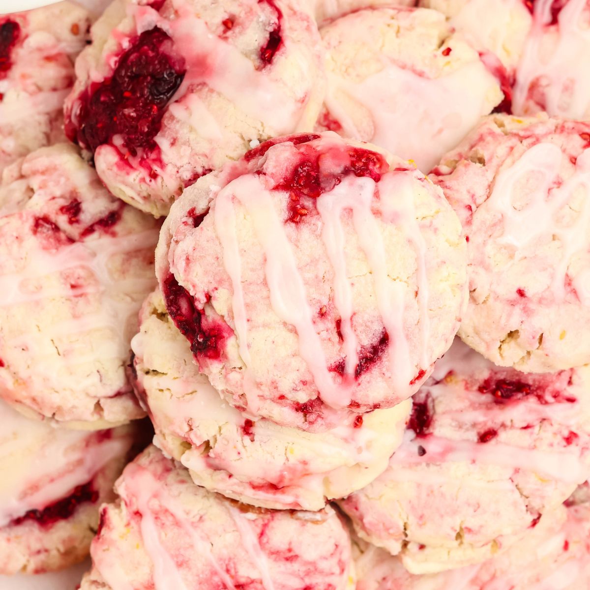 Lemon Raspberry Gluten Free Cookies stacked on a plate.