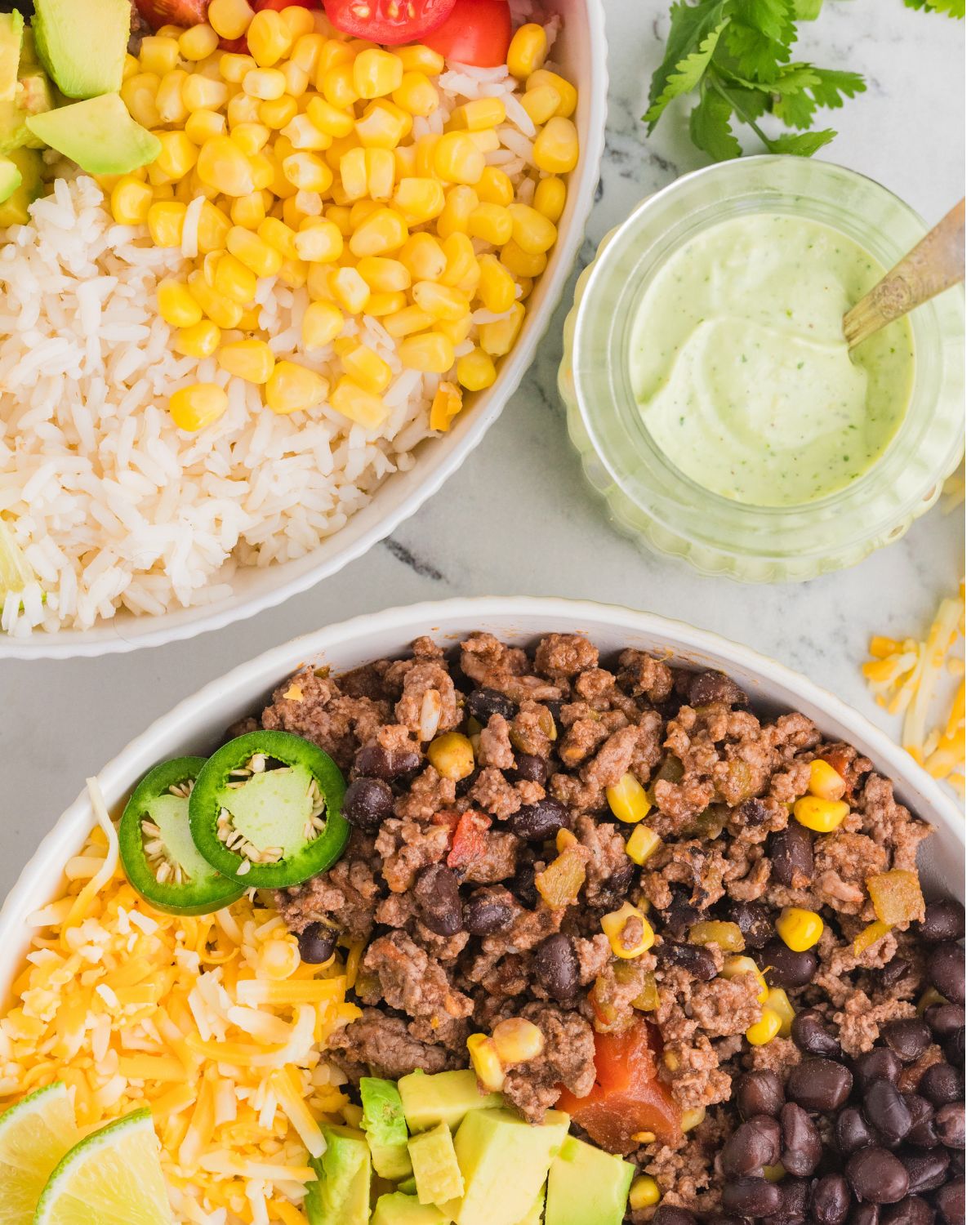 Chipotle style beef burrito bowls with jalapeno, corn, diced tomatoes, and beans.
