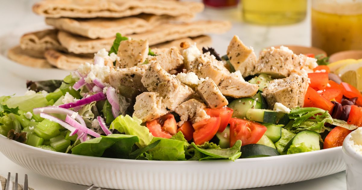 Greek chicken salad recipe in a bowl with a homemade Mediterranean vinaigrette.