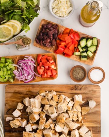 Ingredients to make Greek chicken salad ready to be assembled.