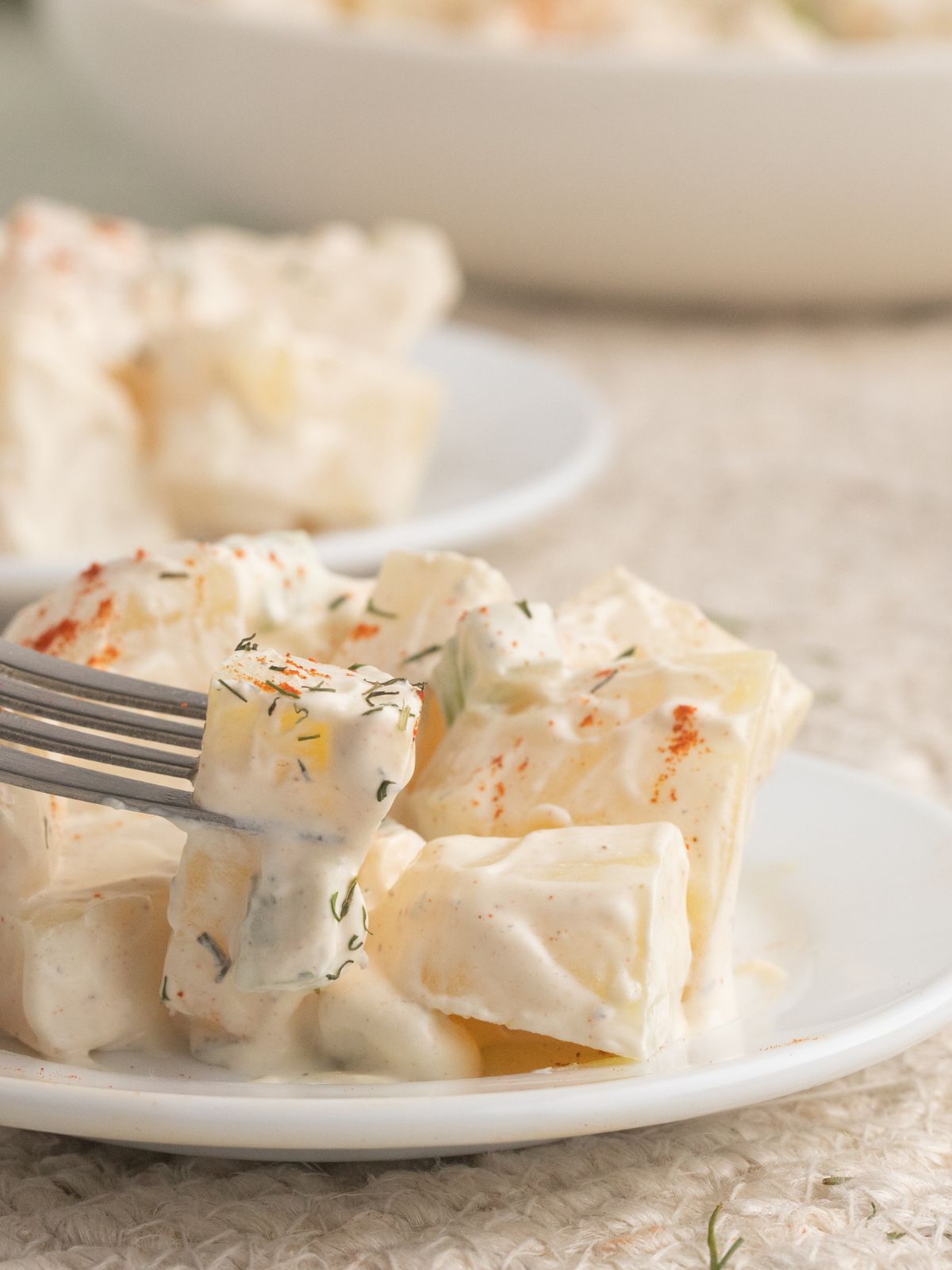 A plate of potato salad without eggs.