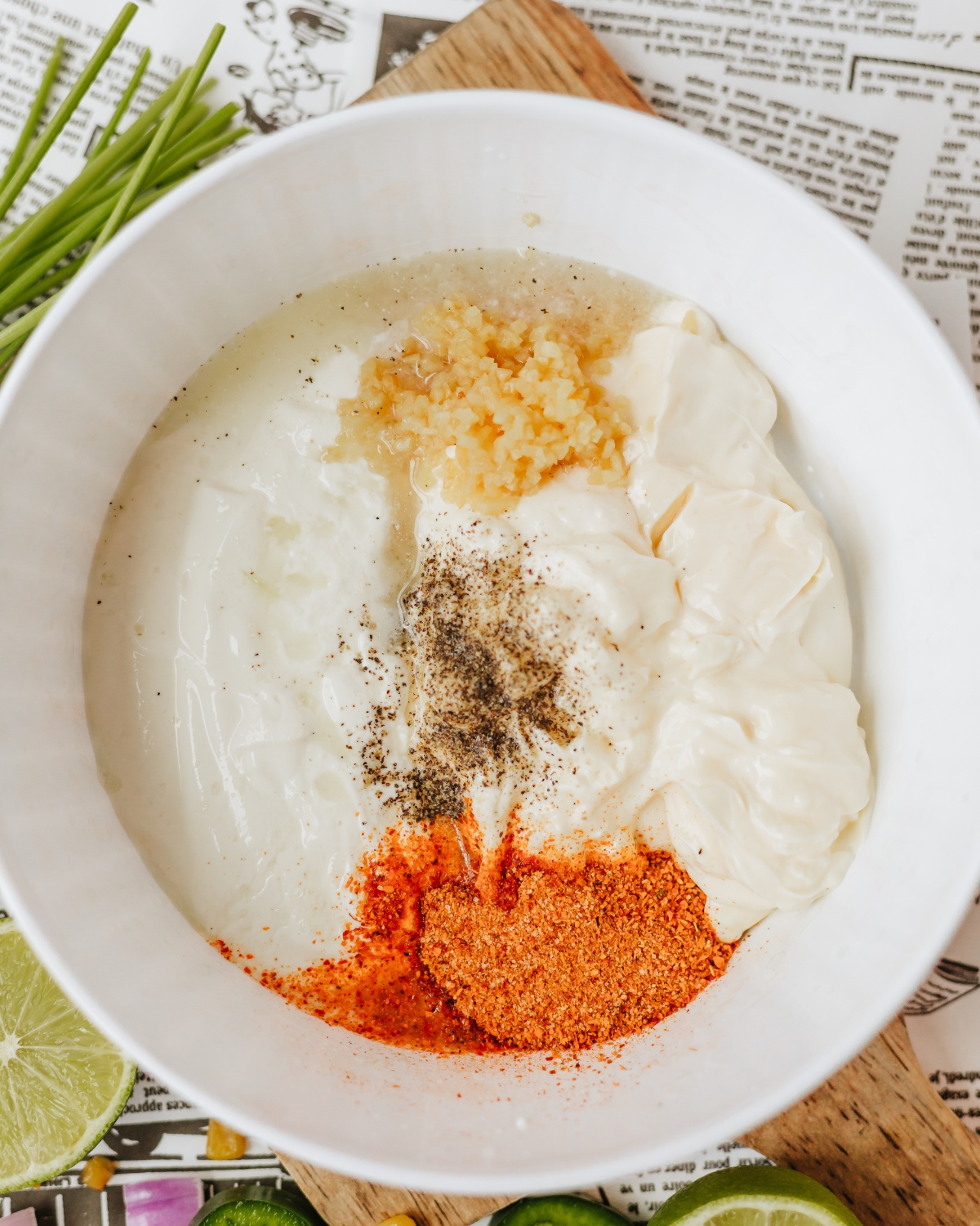 A combination of greek yogurt and spices to make a creamy dressing for Mexican Corn Pasta Salad.