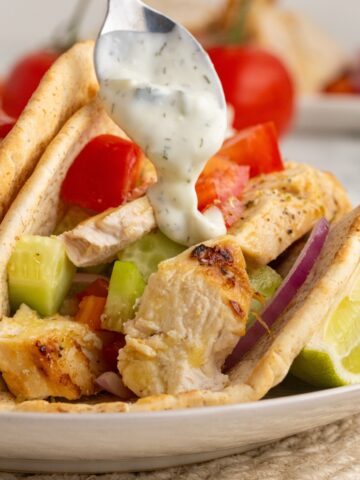 Grilled chicken gyros in a warm pita with a homemade tzatziki sauce.
