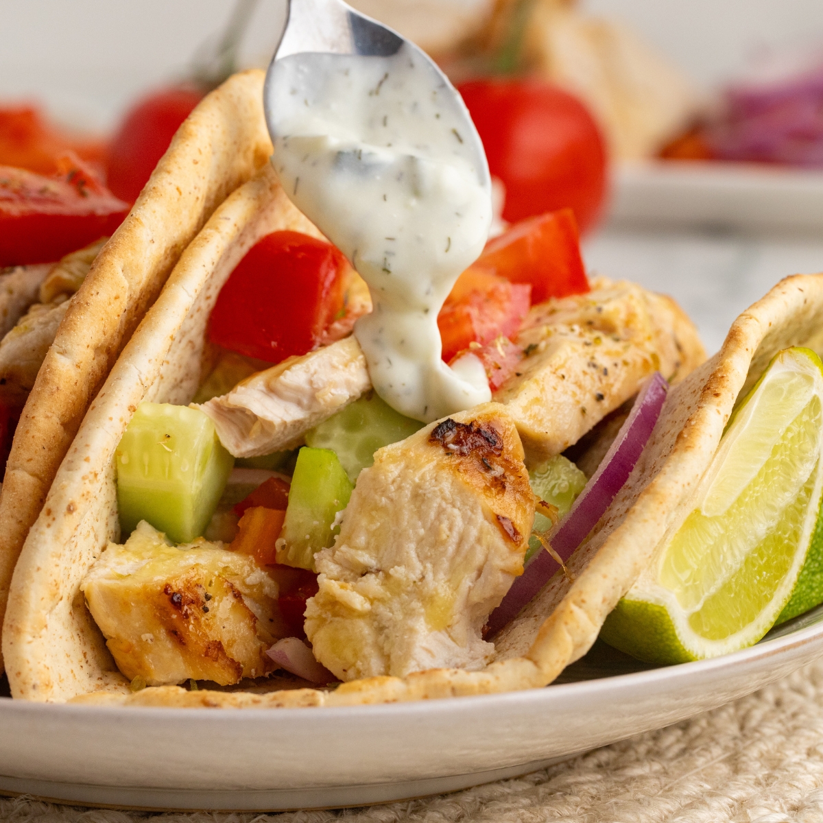 Grilled chicken gyros in a warm pita with a homemade tzatziki sauce.