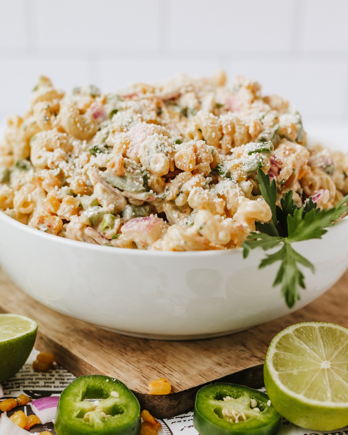 A Mexican pasta salad with corn in a Lime Tajin Dressing.