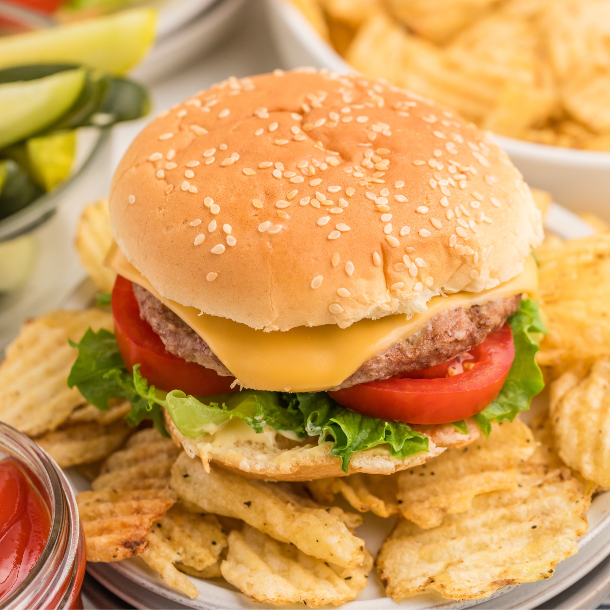 Grilled burgers made from frozen patties on a seeded bun