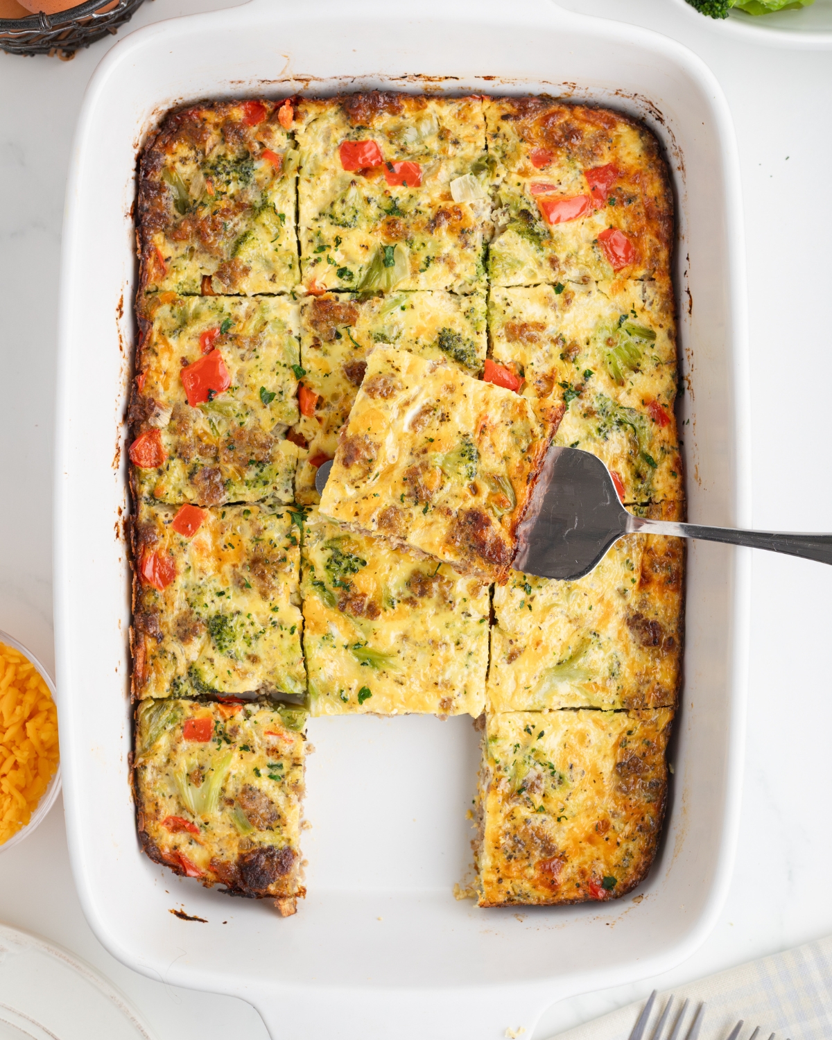 A casserole of sausage egg broccoli and cheese.